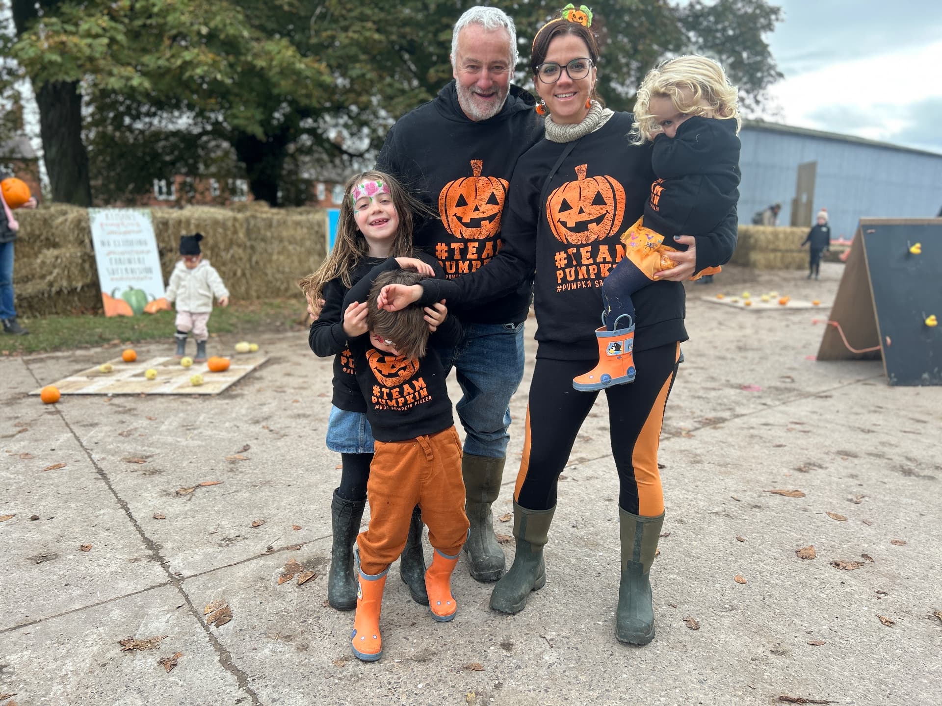 The Ryman family welcoming visitors to the pumpkin patch